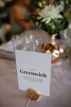 a place card sitting on top of a table