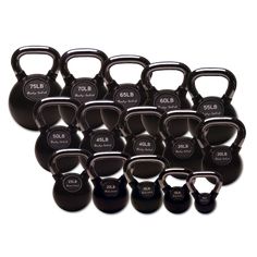 a bunch of black kettles sitting next to each other on top of a white background