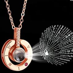 a necklace with a clock on it and words written in different languages around the clock