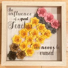 a shadow box with flowers in it and the words, the influence of a great teacher can never be passed