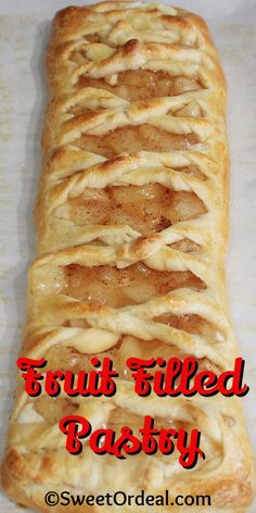 a close up of a pastry with the words fruit filled pastry