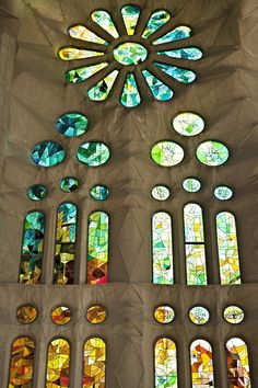 stained glass windows in the interior of a building with many different shapes and colors on them