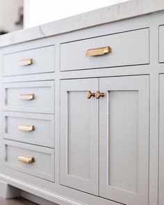 the instagram page on instagram com shows an image of a white dresser with gold handles
