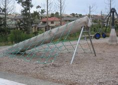 Xena Park playground, Lake Panorama Drive, West Auckland, NZ. Log climb and rocktopus is a feature. Japanese Cedars in the background have died since the subdivision was developed. Climbing, Park Playground, Playground, Natural Playground, Subdivision