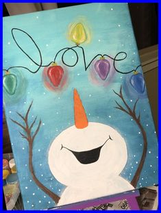 a painting of a snowman with hearts on it's nose and the word love written in large letters