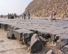 people walking around in front of the great pyramid