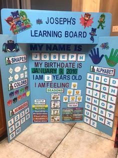 a blue sign that says, joseph's learning board my name is