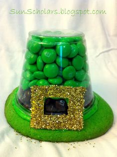 a green hat with gold sequins on it and a photo frame in the center