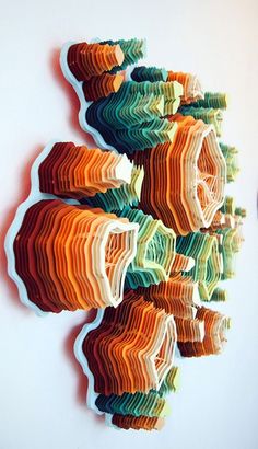 an art piece made out of colored paper