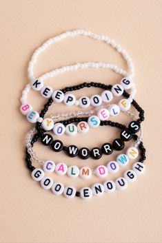 four beaded bracelets with words that spell out the word,'keep going nowhere '