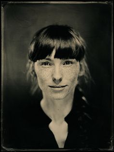 an old photo of a woman with freckles on her face