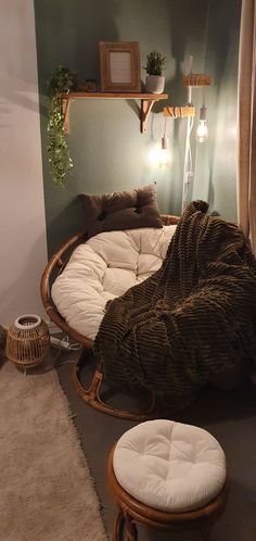 a round bed sitting on top of a floor next to a window