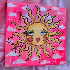 a painting of a sun with eyes and stars on it's face is shown