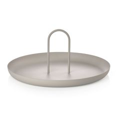 a white tray with a metal handle on it