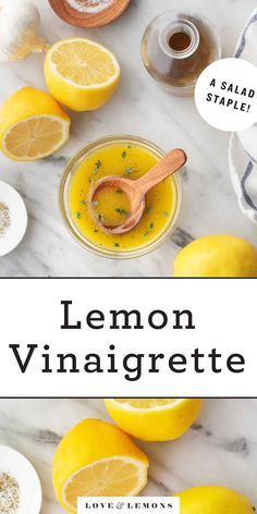 lemon vinaigrette in a glass jar surrounded by lemons and cloves