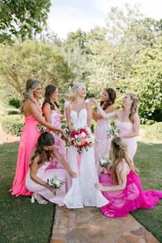 Kacie's beautiful bridesmaids gathered on the grounds of the venue in different bold shades of pink gowns. We love a mix and match bridal party! The bride's luscious bouquet and delicate bridesmaids' bouquets by Miss Milly's complemented the ladies' chic style. Barbie Wedding, Barbie Pink, Pink Gowns, Whimsical Wedding, Bridal Party