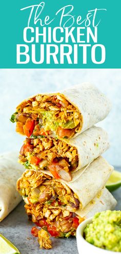three burritos stacked on top of each other with guacamole in the background