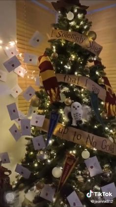 a christmas tree decorated with harry potter themed items