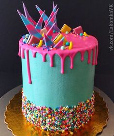 a birthday cake with sprinkles and colorful icing