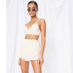 By The Way Tabitha Ruffle Short Set. Crop Top. Ruffle Trim Shorts. Elasticized Waist. Lattice Trim. Two Piece Set. Pale Yellow. Sold On Revolve. Brand New With Tags. Size Small. {Measurements Laying Flat} Shorts Waist: 12.5” Rise: 13” Inseam: 1.75” Top Across The Chest: 14.5” Length: 13” Short Dresses, High Waisted Shorts, Ruffle Shorts, Strapless Romper, Silk Shorts, Sequin Shorts, Shorts Co Ord, Velvet Shorts, Black Short Dress