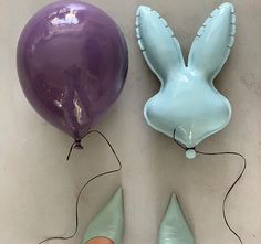a pair of stilettos and a balloon are on the floor next to each other