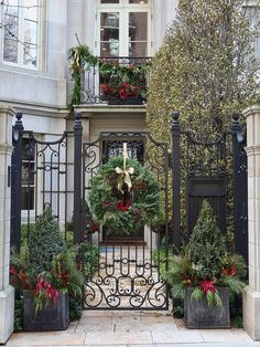 the chicago holiday decorations article is displayed in front of an iron gate with christmas wreaths on it