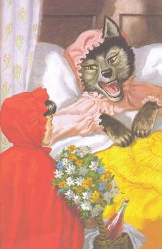 an image of a cat that is laying in bed with two women and flowers on the floor