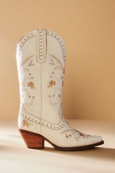 For the bride who makes her own rules, this embroidered floral cowboy boot makes a smashing statement. Perfect for an outdoor or rustic-inspired setting, this stunning style takes you from the ceremony to the dance floor in no time. | Full Bloom Leather Cowboy Boots by Dingo 1969 in White, Women's, Size: 7.5 at Anthropologie Retro, Cowboy Boots, Outfits, Converse, Cowgirl Boots, Upcycling, Country, Leather Cowboy Boots, Brown Cowgirl Boots
