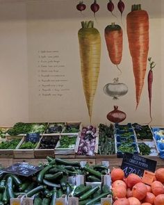 there are many vegetables on display in the store