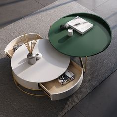 a round coffee table with two circular tables on top and an open book shelf underneath it