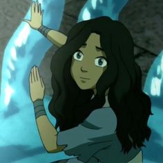 a cartoon girl with long black hair standing in front of a blue wall and holding her hands up