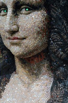 a woman's face made out of bottle caps