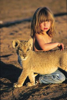 Tippi Degré, the little French girl who spent her childhood in the Africa makes best friends with African wildlife with the greatest of ease. Wild Cats