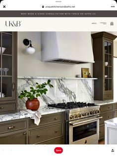 an image of a kitchen with marble counter tops and cabinets on the web page for us & e