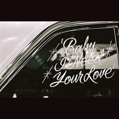 the back window of a car with writing on it that says baby, i need your love