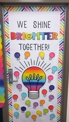 we shine brighter together bulletin board with lightbulbs and rainbow colors on it