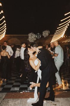 a bride and groom kissing on the dance floor at their wedding reception in las vegas