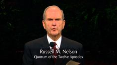 a man in a suit and tie speaking into a microphone with the words russell m nelson on it