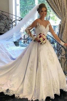 a woman in a wedding dress posing for the camera