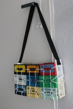 a multicolored cassette bag hanging on the wall