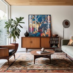 a living room filled with furniture and a painting on the wall above it's coffee table