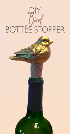 a bottle stopper with a gold bird on it and the words diy bird bottle stopper