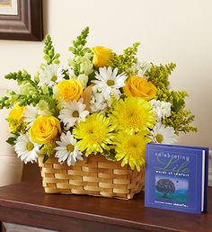 Remember a beautiful life in a truly original way. A vibrant yellow and white sympathy basket arrangement of roses, snapdragons, cremones, stock and more offers comfort during times of loss, while the keepsake book Celebrating Life, by Jim McCann brings lasting memories and reflection. Diy, Spring Floral Arrangements, Flower Decorations