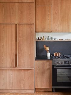 a kitchen with wooden cabinets and an oven