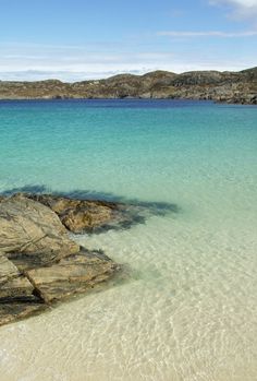 Nope! This crystal clear water is in fact Achmelvich, in Wester Ross on the west coast of Scotland. SCOTLAND! Places To Go, Places To Visit, Places To See, West Coast, Places To Travel