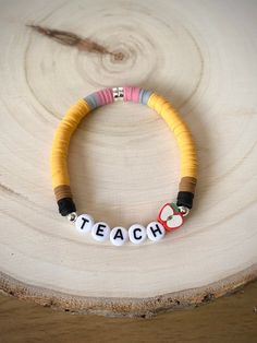 a bracelet with the word teach written on it