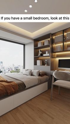 a bedroom with a bed, desk and chair in front of a large window overlooking the city