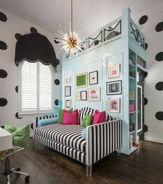 a living room with black and white polka dots on the walls