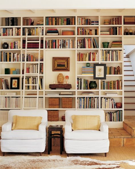 Elegant Arrangement These floor-to-ceiling bookcases are original to the house and hold various family objects such as woven baskets to keep family photos, book collections, and a display area. Bookshelves, Ikea, Home Libraries, Home Décor, Home, Bookshelf Styling, Bookshelf Organization, Room Library, Built In Bookcase