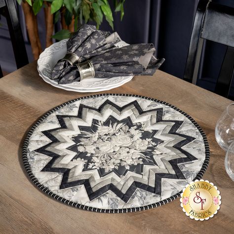 Create a unique centerpiece for your table with the Point of View Folded Star Table Topper designed by PlumEasy using the Steelworks collection by Marcus Fabrics. The center "point of view" features an elegant bouquet and is surrounded by layers of prairie points in coordinating fabrics. Add this classic look to any table setting for an understated and stunning display. Finishes to approximately 17” in diameter. Follow along with Jen as she shows you how to make this amazing project! Kit I Quilts, Table Topper Patterns, Table Toppers, Quilted Table Toppers, Unique Centerpieces, Shabby Fabrics, Placemats, Quilt Kits, Quilting Supplies